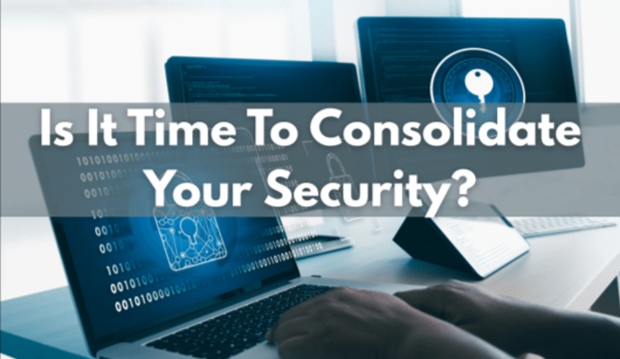 A high-tech digital graphic featuring a professional using a laptop with binary code and lock icons on the screen, overlaid with the text 'Is It Time To Consolidate Your Security?