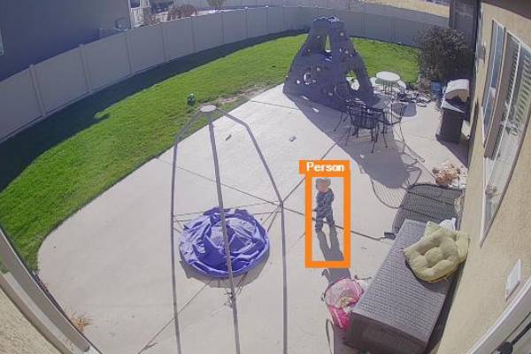A high-definition outdoor security camera installed to monitor a residential pool and backyard area.
