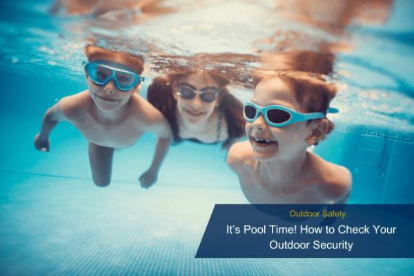 Three children wearing goggles swimming underwater in a residential pool, representing outdoor family safety.