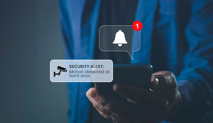 Burglary detection alarm notification displayed on mobile security app during break-in attempt