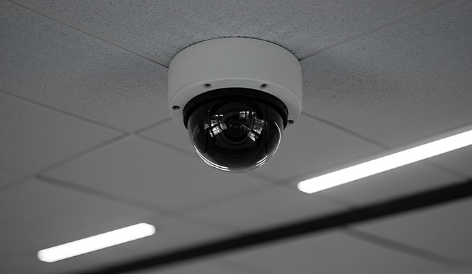Dark dome security camera on ceiling