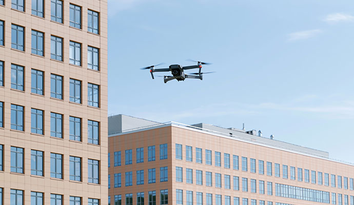 Drone flying near office buildings