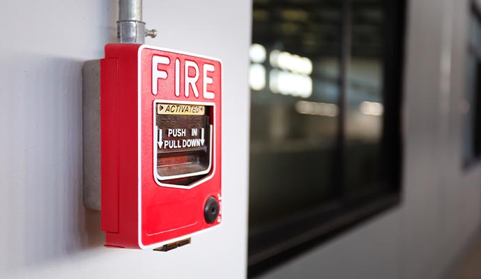 Manual fire alarm pull station mounted on a wall for emergency fire activation