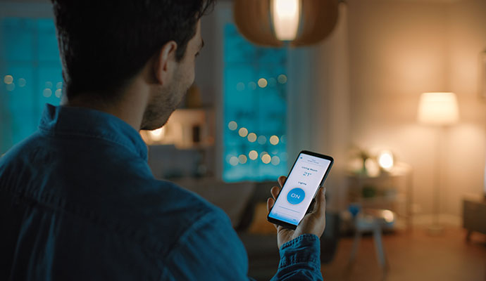 Man using smart home app lighting control