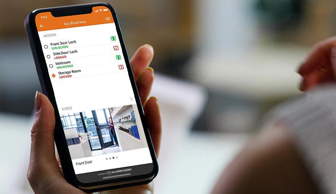 Smartphone displaying business access management and remote door control