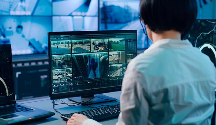 Security operator monitoring CCTV feeds