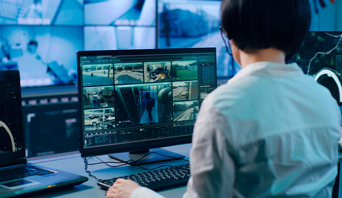 Security operator monitoring camera feeds