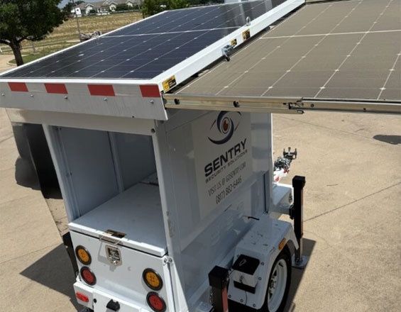 Sentry mobile surveillance trailer deployed in a large parking lot